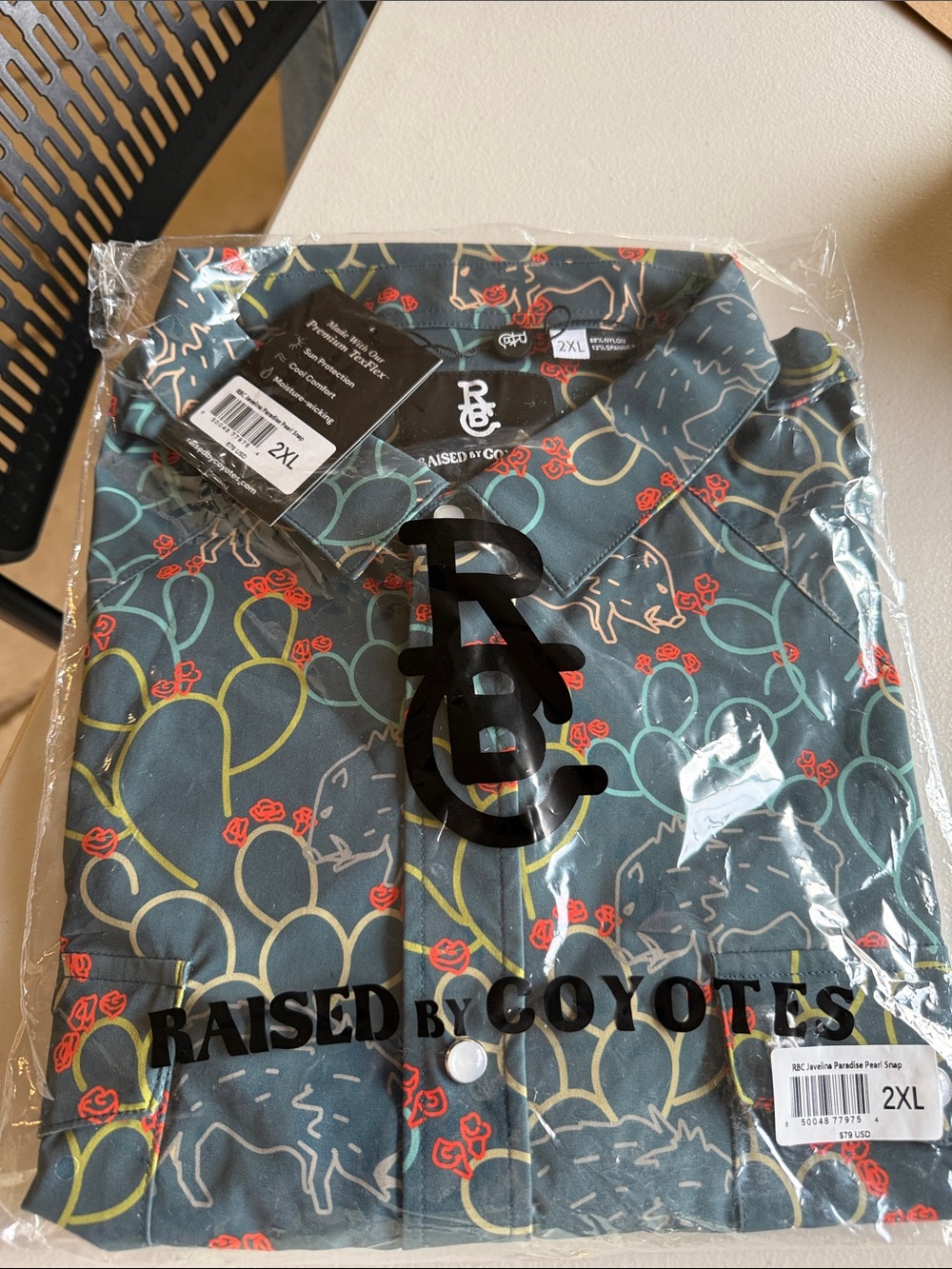 Raised By Coyotes Men's Button-Down Shirt in Teal with Stitch Print